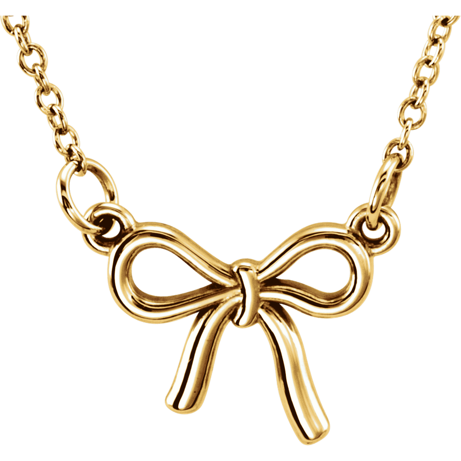 14K yellow gold Tiny Posh knotted bow necklace close-up